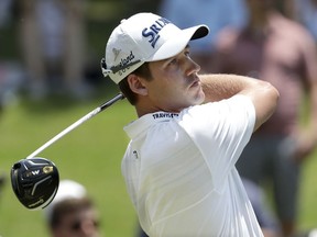 Andrew Putnam watches his drive on the first hole during the final round of the St. Jude Classic golf tournament Sunday, June 10, 2018, in Memphis, Tenn.