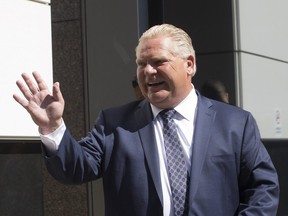 Ontario Premier-designate  Doug Ford arrives at the Postmedia offices in Toronto for an interview with the Toronto Sun and greets supporters on his way into the building  on Friday June 8, 2018.