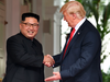North Korean leader Kim Jong Un and U.S. President Donald Trump shake hands at the start of their historic summit, at the Capella Hotel on Sentosa island in Singapore on June 12, 2018.