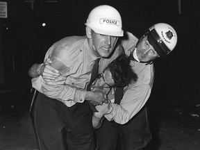 A demonstrator is arrested during the protests that marred the St-Jean-Baptiste parade in Montreal on June 24, 1968.