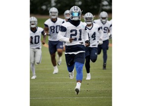 Dallas Cowboys running back Ezekiel Elliott runs during the NFL football team's training camp in Frisco, Texas, Tuesday, June 12, 2018.