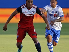FC Dallas defender Reggie Cannon (2) is defended by Montreal Impact forward Jeisson Vargas (16) during the first half of an MLS soccer game in Frisco, Texas, Saturday, June 9, 2018