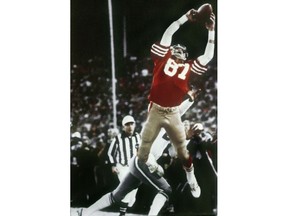 FILE - In this Jan. 10, 1982, file photo, San Francisco 49ers wide receiver Dwight Clark makes "The Catch," a pass from Joe Montana that tied the game, late in the fourth quarter against the Dallas Cowboys in the NFC championship football game at Candlestick Park in San Francisco. Clark, the former 49ers wide receiver whose reception known as "The Catch" sent San Francisco to its first Super Bowl, has died one year after revealing he had ALS. He was 61. The team said Clark died Monday, June 4, 2018, surrounded by friends and family.
