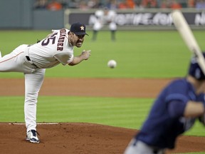Houston Astros starting pitcher Justin Verlander, left, throws to Tampa Bay Rays' Matt Duffy during the first inning of a baseball game Tuesday, June 19, 2018, in Houston.