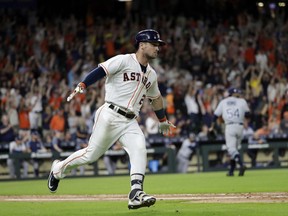 Houston Astros' Alex Bregman (2) celebrates after hitting a game-winning double to score two runs against the Tampa Bay Rays during the ninth inning of a baseball game Monday, June 18, 2018, in Houston. The Astros won 5-4.