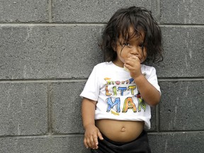 Jesus Funes, 19-months-old, an immigrant from Honduras, eats a banana after crossing back into Reynosa, Mexico, with his family Thursday, June 21, 2018. The family, who was seeking asylum, said they were told by officials they would be separated so they voluntarily returned to Mexico.