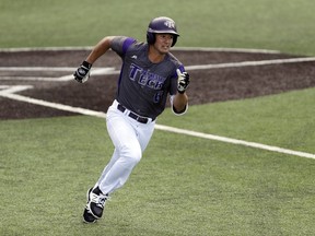 Tennessee Tech's David Garza runs to first base after hitting a double against Texas in the fifth inning of an NCAA college super regional baseball game, Saturday, June 9, 2018, in Austin, Texas. Tennessee Tech won 5-4.