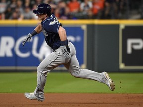 Tampa Bay Rays' Jake Bauers runs to second for a double during the first inning of a baseball game against the Houston Astros, Wednesday, June 20, 2018, in Houston.