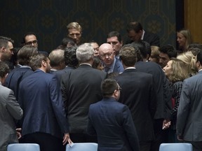 Russian Ambassador to the United Nations Vassily Nebenzia, center, and American Ambassador to the United Nations Nikki Haley, center, left, are surrounded by diplomats before a Security Council meeting on the situation between the Israelis and the Palestinians, Friday, June 1, 2018 at United Nations headquarters.