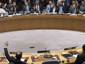 British Ambassador to the United Nations Karen Pierce, top left, abstains from voting a resolution introduced by Kuwait during a Security Council meeting on the situation between the Israelis and the Palestinians, Friday, June 1, 2018 at United Nations headquarters.