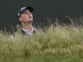 Michael Miller checks his line to the green during a practice round for the U.S. Open Golf Championship, Wednesday, June 13, 2018, in Southampton, N.Y.