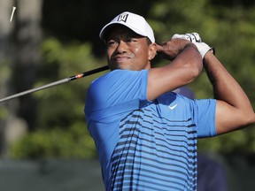 Tiger Woods tees off the fourth hole during a practice round for the U.S. Open Golf Championship, Tuesday, June 12, 2018, in Southampton, N.Y.