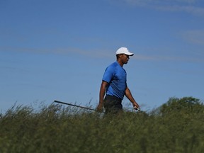 Tiger Woods walks up to the sixth tee during a practice round for the U.S. Open Golf Championship, Tuesday, June 12, 2018, in Southampton, N.Y.
