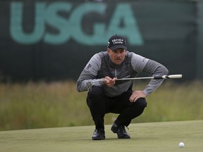 Henrik Stenson of Sweden lines up a shot on the fourth green during the second round of the U.S. Open Golf Championship, Friday, June 15, 2018, in Southampton, N.Y.