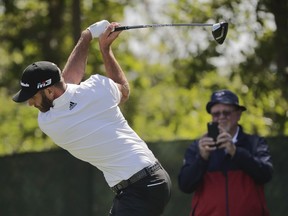 Dustin Johnson tees off on the third hole during a practice round for the U.S. Open Golf Championship, Monday, June 11, 2018, in Southampton, N.Y.