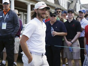Tommy Fleetwood, of England, walks to the 14th tee during the second round of the U.S. Open Golf Championship, Friday, June 15, 2018, in Southampton, N.Y.