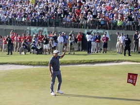 Brooks Koepka reacts after finishing the final round of the U.S. Open Golf Championship, Sunday, June 17, 2018, in Southampton, N.Y.