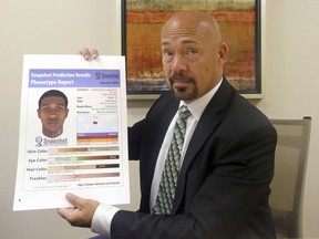Private investigator Jason Jensen holds a phenotype report at his office Friday, June 15, 2018, in Salt Lake City. Groups of private investigators in Utah and California have been emboldened by the arrest of the suspected Golden State Killer and are spearheading a push to replicate authorities' use of DNA evidence in that case by urging amateur genealogists to contribute genetic information to a public DNA database, despite concerns about privacy.