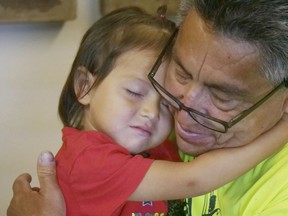 Romulo Gonzalez Rodriguez and his 3-year-old daughter Genesis hug during a interview Tuesday, June 19, 2018, in Provo, Utah. Gonzalez Rodriguez spoke about the anguish of being separated from his 3-year-old daughter, Genesis Gonzalez Lopez, for seven days in November after arriving to the U.S. port of entry in San Diego. Gonzalez Rodriguez said he fled his hometown of Champerico, Guatemala to seek asylum in the United States after he was kidnapped and extorted by captors who cut his eye out and nearly killed him.