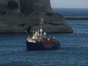 The ship operated by German aid group Mission Lifeline, carrying 234 migrants, arrives at the Valletta port in Malta, after a journey of nearly a week while awaiting permission to make landfall, Wednesday, June 27, 2018. Eight European nations agreed to accept the passengers who qualify as refugees.