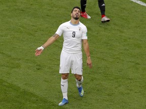 Uruguay's Luis Suarez reacts after failing to score during the group A match between Egypt and Uruguay at the 2018 soccer World Cup in the Yekaterinburg Arena in Yekaterinburg, Russia, Friday, June 15, 2018.