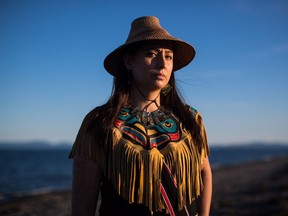 Mique'l Dangeli, of the Tsimshian First Nation, poses for a photograph in Tsawwassen, B.C., on Saturday June 23, 2018. A First Nations woman working to revive a threatened language in her traditional territory of northern British Columbia says she's being forced to leave the country on Canada Day. Dangeli belongs to the Tsimshian First Nation, whose territory straddles the border between Alaska and British Columbia. She says Canada won't recognize her right to live and work in B.C. because she happened to be born on the American side on Annette Island Indian Reserve.