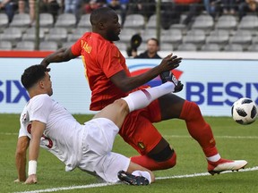 Portugal's Pepe, left, tackles Belgium's Romelu Lukaku during a friendly soccer match between Belgium and Portugal at the King Baudouin stadium in Brussels, Saturday, June 2, 2018.