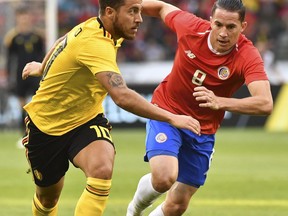 Belgium's Eden Hazard, left, vies for the ball with Costa Rica's Bryan Oviedo during a friendly soccer match between Belgium and Costa Rica at the King Baudouin stadium in Brussels, Monday, June 11, 2018.