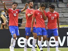 Costa Rica's Bryan Ruiz, left, jubilates with teammate Costa Rica's Bryan Oviedo after scoring his sides first goal during a friendly soccer match between Belgium and Costa Rica at the King Baudouin stadium in Brussels, Monday, June 11, 2018.