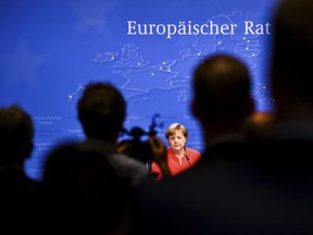German Chancellor Angela Merkel speaks during a media conference at an EU summit in Brussels, Friday, June 29, 2018. European Union leaders cried victory Friday, claiming to have set aside major differences over how best to handle migrant arrivals.