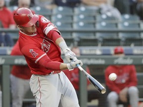 Los Angeles Angels' Mike Trout hits a solo home run against the Seattle Mariners during the first inning of a baseball game, Monday, June 11, 2018, in Seattle.