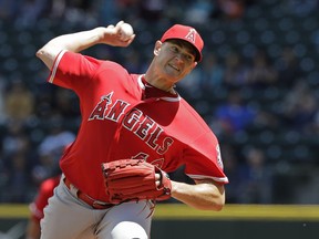 Los Angeles Angels starting pitcher Garrett Richards throws against the Seattle Mariners during the first inning of a baseball game, Wednesday, June 13, 2018, in Seattle.