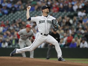 Seattle Mariners starting pitcher Mike Leake throws to a Los Angeles Angels batter during the first inning of a baseball game Tuesday, June 12, 2018, in Seattle.