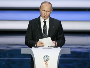 In this Dec. 1 file photo, Russian President Vladimir Putin speaks at the 2018 World Cup draw at the Kremlin in Moscow. POLICE have been ordered not to -publish any information about crimes during the World Cup as Vladimir -Putin attempts to craft an image of -Russia as a transgression-free zone.