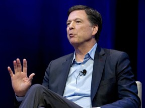 FILE - In this April 30, 2018, file photo, former FBI director James Comey speaks during a stop on his book tour in Washington. Comey is about to get dinged in an internal review by the Justice Department, and President Donald Trump says he can't wait.