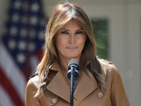 FILE - in this May 7, 2018, file photo, First lady Melania Trump speaks on her initiatives during an event in the Rose Garden of the White House in Washington. Melania Trump is trying to tamp down speculation about why she has not been seen in public in nearly three weeks, but it isn't completely working.