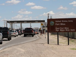 FILE - In this Sept. 9, 2014, file photo, cars wait to enter Fort Bliss in El Paso, Texas. The U.S. Department of Homeland Security has formally requested space for up to 12,000 beds at a military base to detain families caught crossing the border illegally, two Trump administration officials said Wednesday, June 27, 2018. The facility will be housed at a military base, but it's not clear yet which one. Defense Secretary Jim Mattis said that two bases had been identified to house migrants: Goodfellow Air Force Base near San Angelo, Texas, and Fort Bliss.