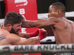 Reggie Barnett, right, fights Travis Thompson during the Bare Knuckle Fighting Championship event Saturday, June 2, 2018, in Cheyenne, Wyo. The night was promoted as the first sanctioned bare-knuckle fighting in more than a century.