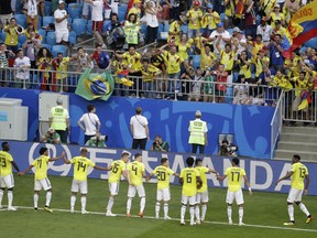 Colombia's Yerry Mina, right, celebrates with his teammates after scoring his side's first goal during the group H match between Senegal and Colombia, at the 2018 soccer World Cup in the Samara Arena in Samara, Russia, Thursday, June 28, 2018.