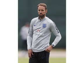 England head coach Gareth Southgate watches his players take part in a training session for the England team at the 2018 soccer World Cup, in the Spartak Zelenogorsk ground, Zelenogorsk near St. Petersburg, Russia, Thursday, June 21, 2018.