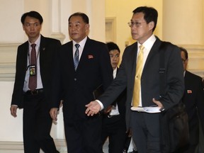 FILE - In this June 10, 2018 file photo, North Korean Kim Yong Chol, center, arrives at the Istana or presidential palace in Singapore. Kim Yong Chol, 72, has been Kim Jong Un's most trusted policy adviser since the North Korean leader began a peace offensive with the U.S. and South Korea in January.