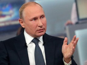 Russian President Vladimir Putin gestures while answering a question during his annual call-in show in Moscow, Russia, Thursday, June 7, 2018. Putin hosts call-in shows every year, which typically provide a platform for ordinary Russians to appeal to the president on issues ranging from foreign policy to housing and utilities.