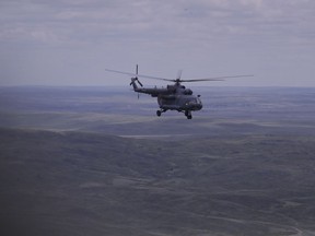 A Russian search and rescue team helicopter flies from the Kazakh town of Karaganda to Dzhezkazgan, on the eve of Russian Soyuz MS space capsule landing, Kazakhstan, Kazakhstan, Sunday, June 3, 2018. The return of the Soyuz space capsule with Russian cosmonaut Anton Shkaplerov, U.S. astronaut Scott Tingle, and Japanese astronaut Norishige Kanai, crew members of the mission to the International Space Station, ISS is scheduled on Sunday, June 3, 2018.