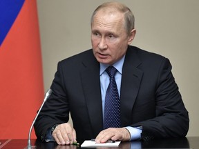 Russian President Vladimir Putin chairs a Security Council meeting at the Novo-Ogaryovo residence outside Moscow, Russia, Thursday, June 21, 2018.