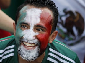 A Mexico's football fan smiles ahead of the group F match between Germany and Mexico at the 2018 soccer World Cup in the Luzhniki Stadium in Moscow, Russia, Sunday, June 17, 2018.