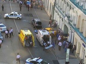 In this image provided by Moscow Traffic Control Center Press Service, ambulance and police work at the site of an incident after a taxi crashed into pedestrians on a sidewalk near Red Square in Moscow, Russia, Saturday, June 16, 2018. Police in Moscow say at least seven people have been injured when a taxi crashed into pedestrians on a sidewalk near Red Square. (Moscow Traffic Control Center Press Service via AP)