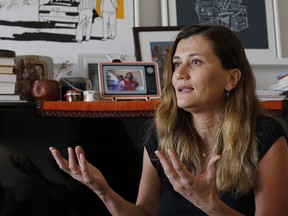 In this Thursday, June 7, 2018 photo, Lebanese May Elian, activist for "My Nationality is My Right and My Family's Right" campaign, speaks during an interview with The Associated Press at her house in Beirut, Lebanon. A Lebanese presidential decree to naturalize hundreds of foreigners including Iraq's Vice President Iyad Allawi and other regional elites has ignited a row over who deserves citizenship in this tiny Mediterranean country, where one in four people is a refugee.