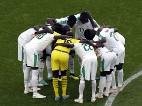 Senegal team embrace prior to the group H match between Japan and Senegal at the 2018 soccer World Cup at the Yekaterinburg Arena in Yekaterinburg , Russia, Sunday, June 24, 2018.