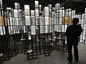 A visitor examines a display at the Polish Vodka Museum, a new museum that will open next week, in Warsaw, Poland, Wednesday, June 6, 2018. The museum is devoted solely to Polish vodka, a national tradition of more than 500 years and one of the country's best-known exports.
