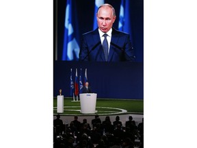 Russian President Vladimir Putin speaks to global soccer leaders at the FIFA congress on the eve of the opener of the 2018 soccer World Cup in Moscow, Russia, Wednesday, June 13, 2018. The congress in Moscow is set to choose the host or hosts for the 2026 World Cup.